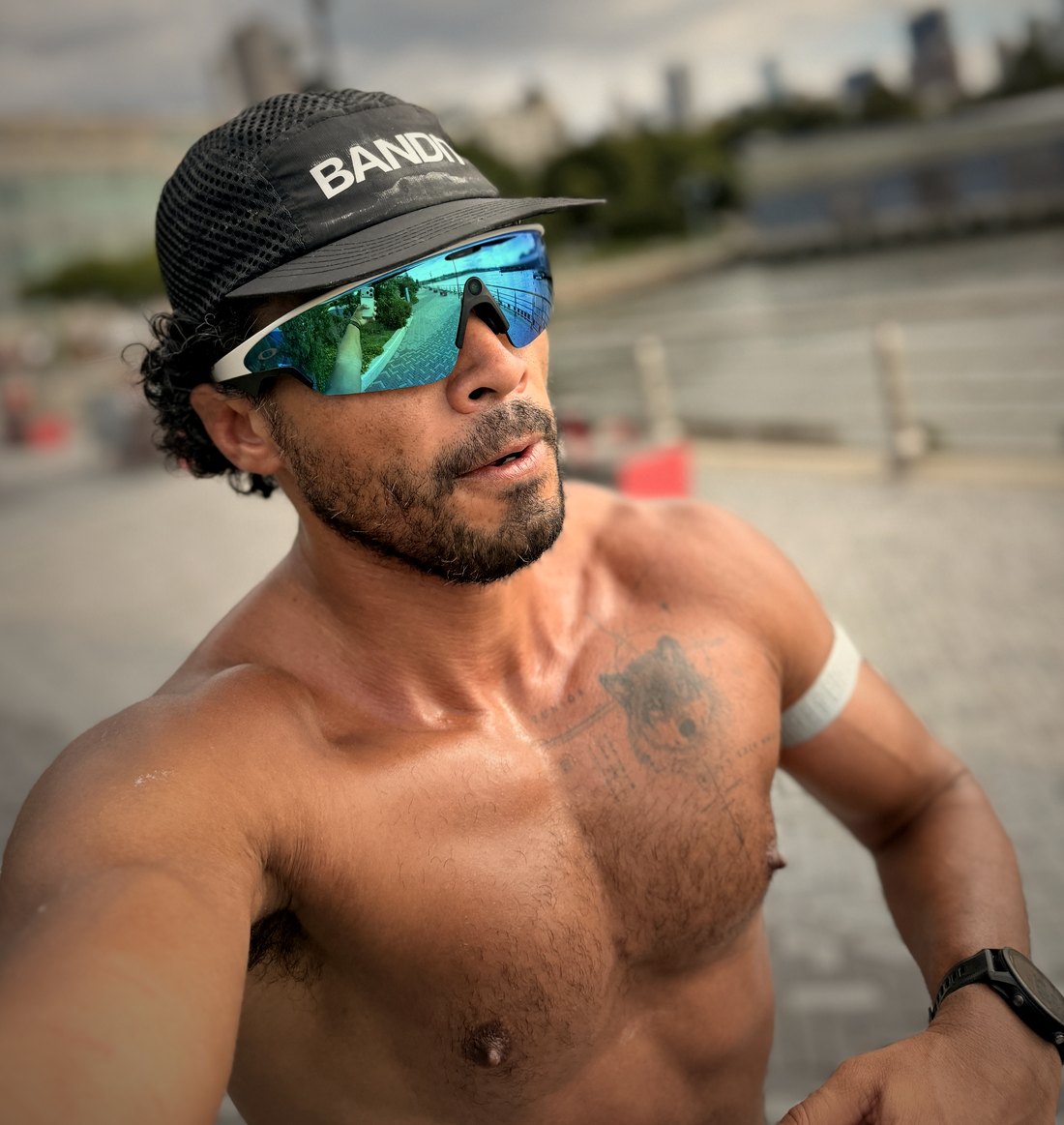 Juan C. Zuniga Jr., peptide and biohacking educator, shirtless after a run on the waterfront